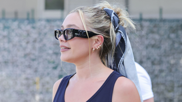 Florence Pugh wearing a scarf around her messy bun