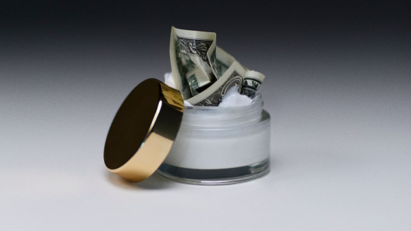 jar of moisturizer with cash stuff inside